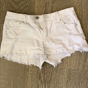 White ripped jean shorts